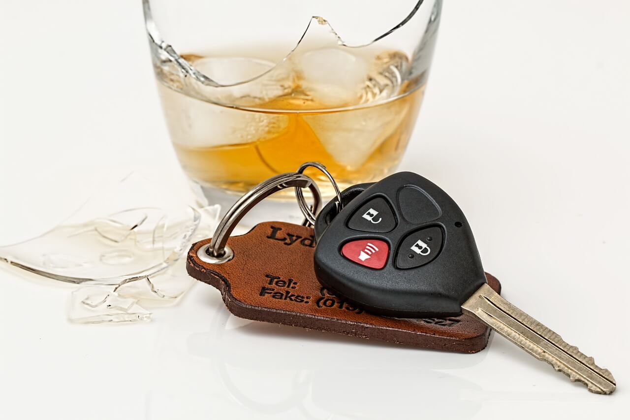 broken liquor glass with car keys
