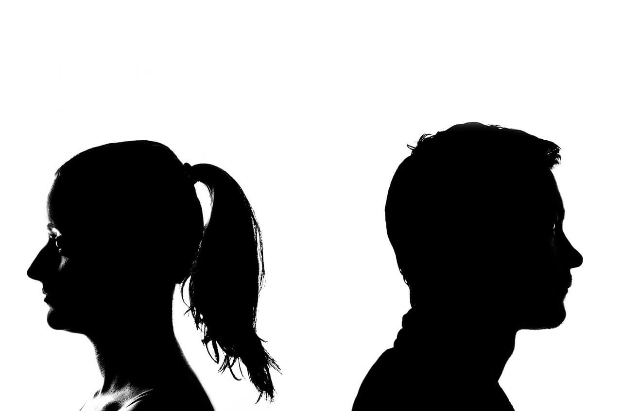male and female silhouettes facing away from each other