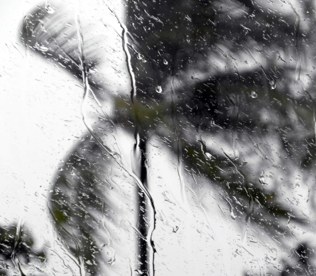 close up of rain on a window during a heavy storm or hurricane