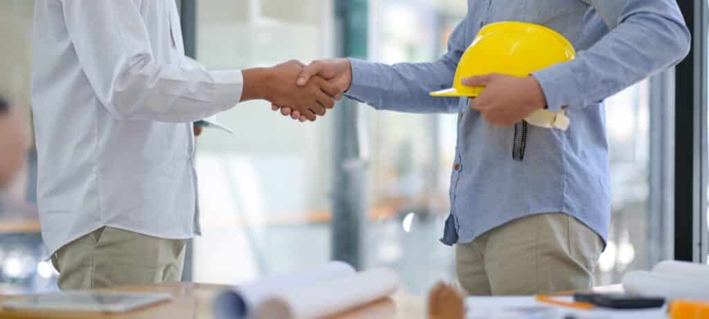 homeowner shaking hands with contractor