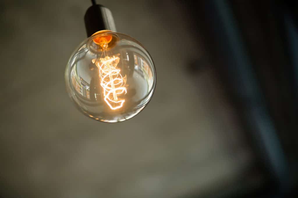 round vintage lightbulb with glowing filament