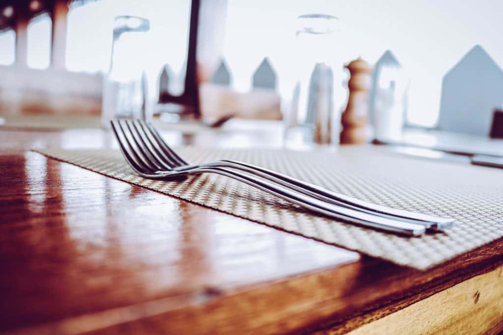 silverware sitting on restaurant table