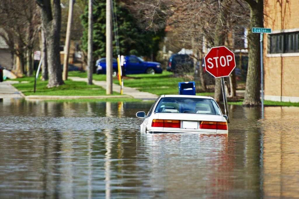 car half submerged by flood waters